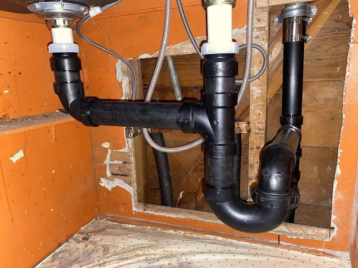 Professional Garbage Disposal Repair equipment and tools on the job in Babylon